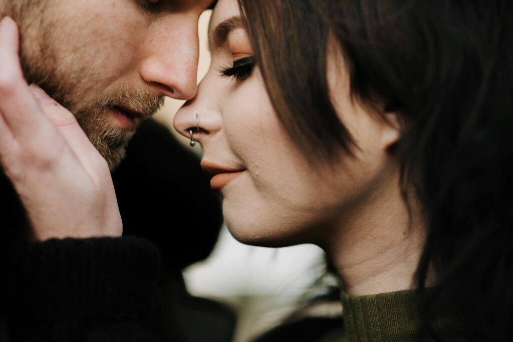 crop couple caressing on street